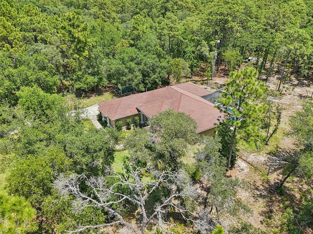 drone / aerial view with a view of trees