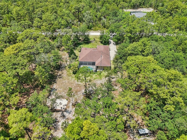 drone / aerial view featuring a forest view