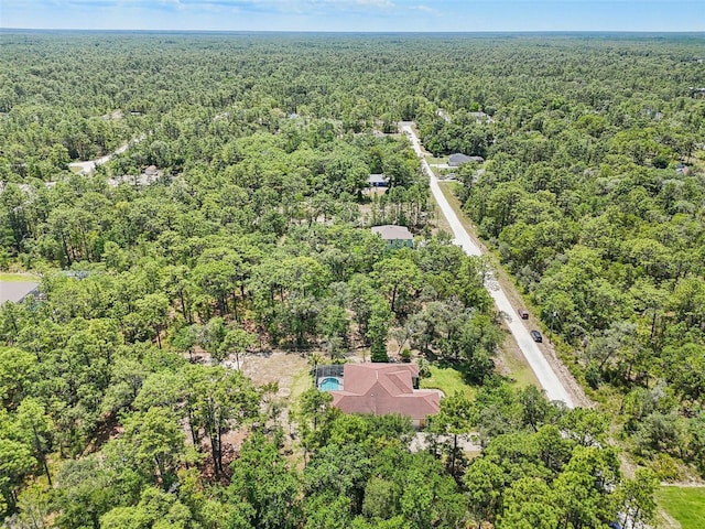 aerial view featuring a forest view