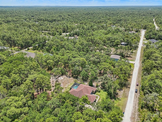 drone / aerial view with a view of trees