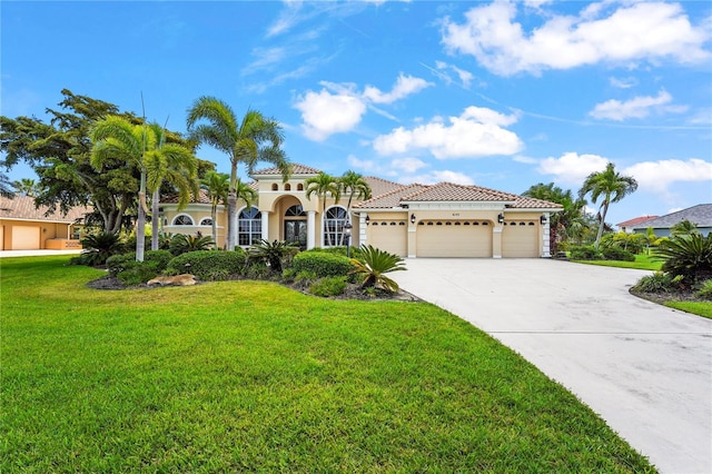6143 9th Avenue Cir NE, Bradenton, FL 34212 - mediterranean / spanish home featuring a garage, stucco siding, concrete driveway, a front lawn, and a tiled roof