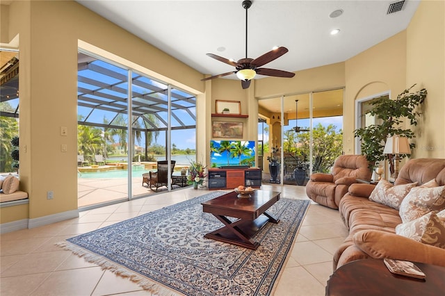 6143 9th Avenue Cir NE, Bradenton, FL 34212 - living room with tile patterned flooring, plenty of natural light, a ceiling fan, a sunroom, and recessed lighting