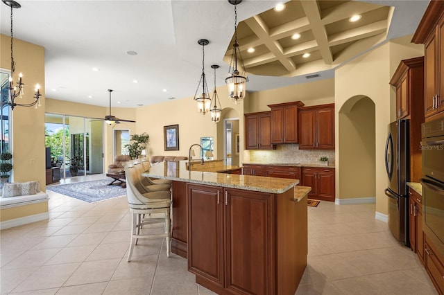 6143 9th Avenue Cir NE, Bradenton, FL 34212 - kitchen featuring black appliances, a chandelier, arched walkways, light tile patterned flooring, and recessed lighting