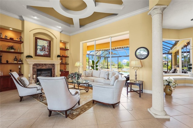 6143 9th Avenue Cir NE, Bradenton, FL 34212 - living area with decorative columns, ornamental molding, built in features, light tile patterned floors, and a premium fireplace