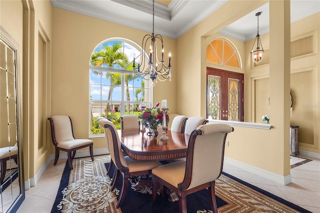 6143 9th Avenue Cir NE, Bradenton, FL 34212 - dining area featuring ornamental molding, light tile patterned flooring, a chandelier, and baseboards