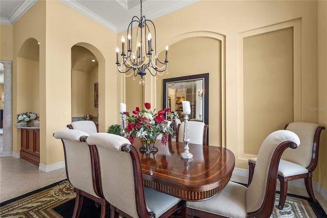 6143 9th Avenue Cir NE, Bradenton, FL 34212 - dining room featuring arched walkways, a chandelier, crown molding, tile patterned flooring, and baseboards