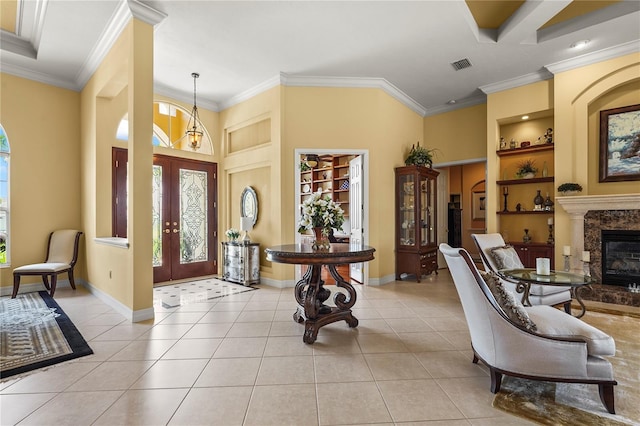6143 9th Avenue Cir NE, Bradenton, FL 34212 - foyer entrance featuring plenty of natural light, baseboards, light tile patterned floors, ornamental molding, and french doors