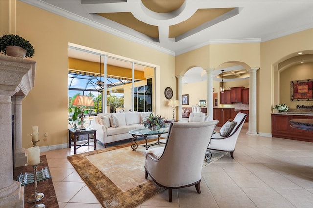 6143 9th Avenue Cir NE, Bradenton, FL 34212 - living room with ornate columns, light tile patterned flooring, ornamental molding, ceiling fan, and baseboards
