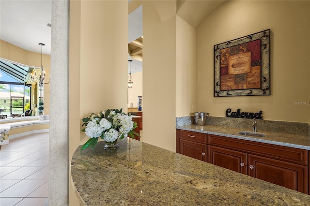6143 9th Avenue Cir NE, Bradenton, FL 34212 - bar featuring light tile patterned flooring, a sink, a chandelier, and decorative light fixtures