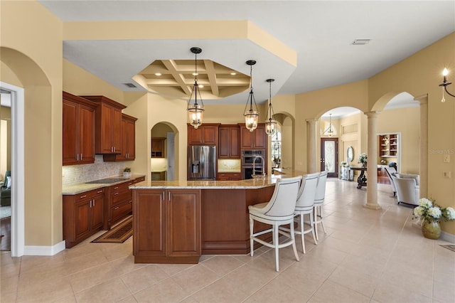 6143 9th Avenue Cir NE, Bradenton, FL 34212 - kitchen with stainless steel appliances, arched walkways, coffered ceiling, decorative columns, and backsplash
