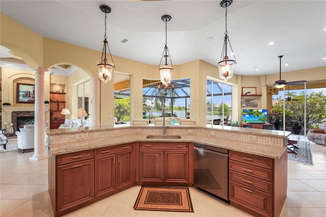 6143 9th Avenue Cir NE, Bradenton, FL 34212 - kitchen with stainless steel dishwasher, open floor plan, a sink, light stone counters, and recessed lighting