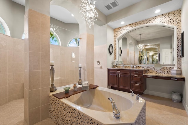 6143 9th Avenue Cir NE, Bradenton, FL 34212 - full bathroom featuring a garden tub, a walk in shower, vanity, and tile patterned flooring