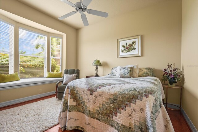 6143 9th Avenue Cir NE, Bradenton, FL 34212 - bedroom with wood finished floors, baseboards, and a ceiling fan