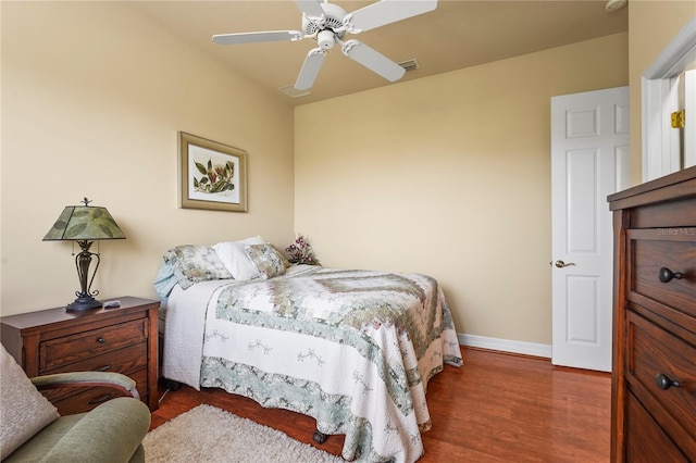 6143 9th Avenue Cir NE, Bradenton, FL 34212 - bedroom with wood finished floors, baseboards, and a ceiling fan
