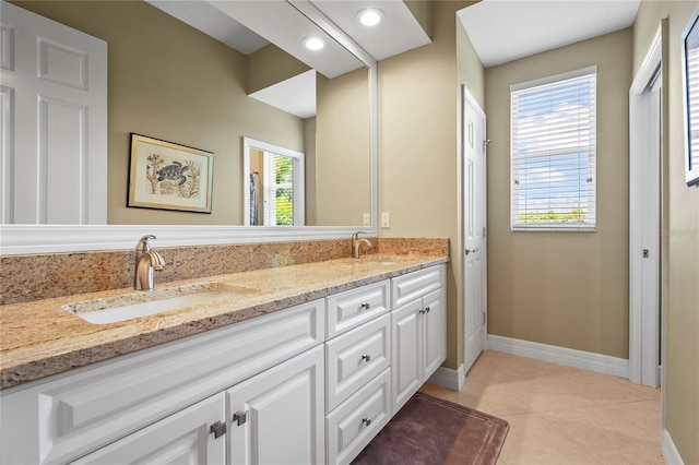 6143 9th Avenue Cir NE, Bradenton, FL 34212 - full bath with double vanity, baseboards, tile patterned floors, and recessed lighting