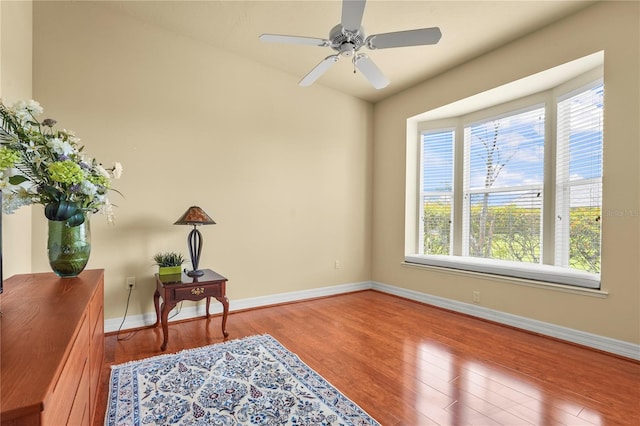 6143 9th Avenue Cir NE, Bradenton, FL 34212 - sitting room featuring plenty of natural light, wood finished floors, baseboards, and ceiling fan