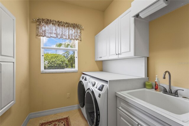 6143 9th Avenue Cir NE, Bradenton, FL 34212 - laundry room featuring washing machine and dryer, cabinet space, light tile patterned flooring, and baseboards