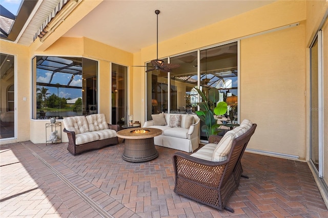 6143 9th Avenue Cir NE, Bradenton, FL 34212 - view of patio / terrace with an outdoor living space with a fire pit