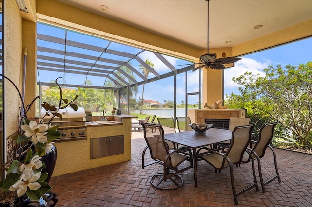 6143 9th Avenue Cir NE, Bradenton, FL 34212 - view of patio with a water view, outdoor dining area, a lanai, and a sink