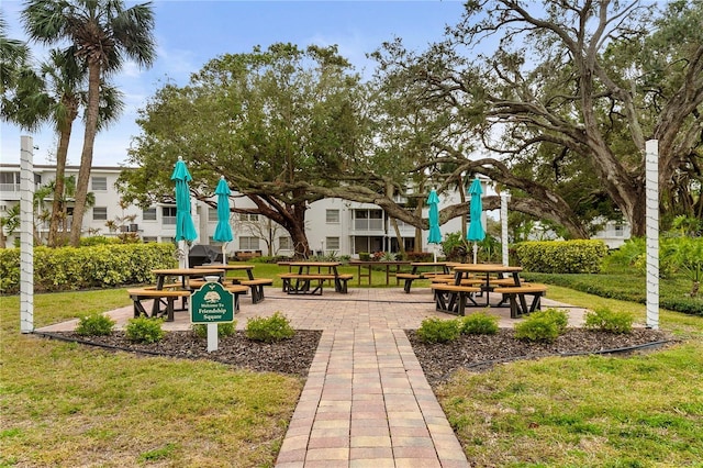 view of home's community featuring a lawn