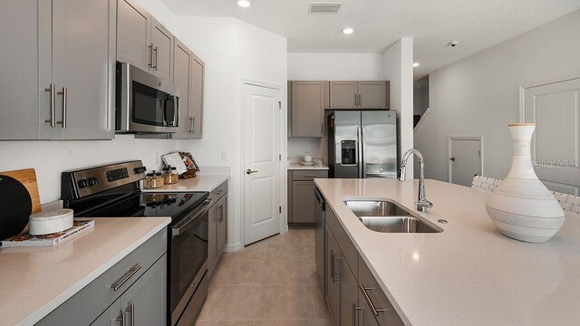 15192 Cuzcorro Ct, Nokomis, FL 34275 - kitchen featuring a sink, stainless steel appliances, and gray cabinetry