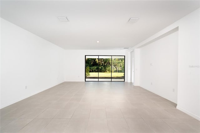 10171 Milky Way Cir, Sarasota, FL 34241 - unfurnished room featuring visible vents, baseboards, and light tile patterned flooring