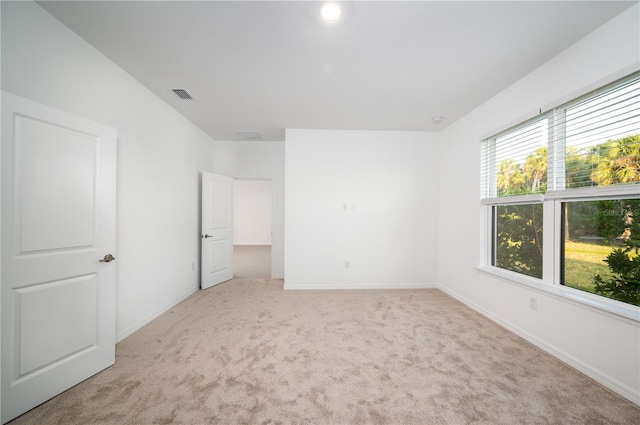 10171 Milky Way Cir, Sarasota, FL 34241 - unfurnished bedroom featuring baseboards, visible vents, and light colored carpet