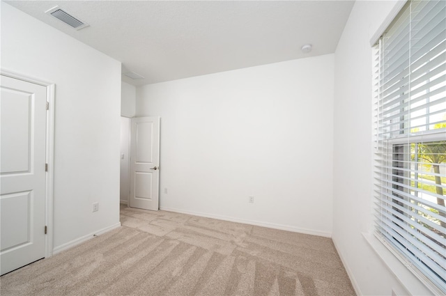 10171 Milky Way Cir, Sarasota, FL 34241 - unfurnished room with carpet floors, baseboards, and visible vents