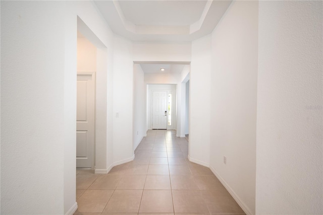 10171 Milky Way Cir, Sarasota, FL 34241 - corridor featuring baseboards and light tile patterned flooring