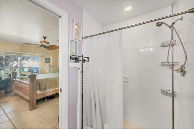 9366 Westminster Ave, Englewood, FL 34224 - ensuite bathroom with a tile shower, ceiling fan, and tile patterned flooring