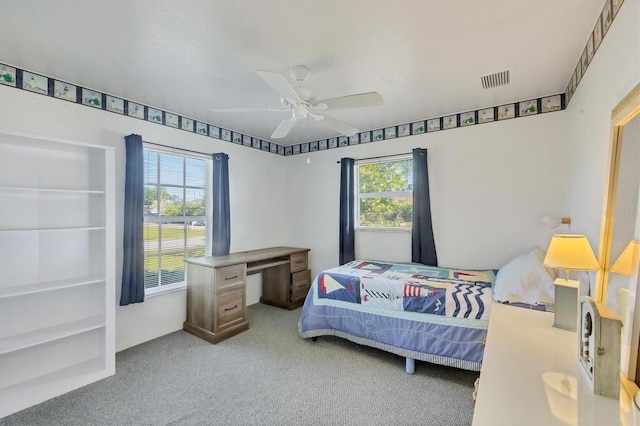 9366 Westminster Ave, Englewood, FL 34224 - carpeted bedroom with multiple windows and ceiling fan