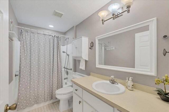 9366 Westminster Ave, Englewood, FL 34224 - bathroom featuring vanity, shower / bathtub combination with curtain, and tile patterned flooring