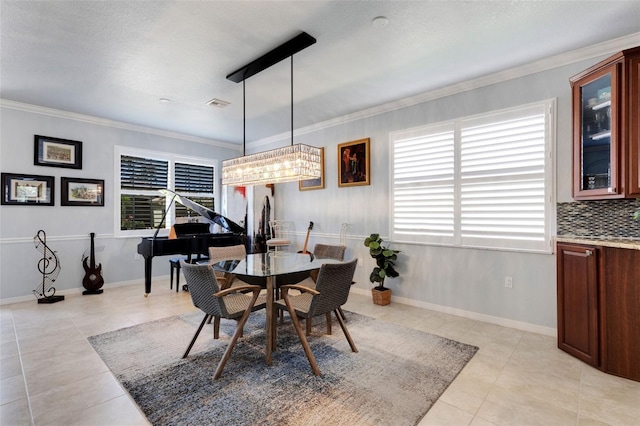 212 River Enclave Ct, Bradenton, FL 34212 - dining space with light tile patterned flooring, ornamental molding, and baseboards