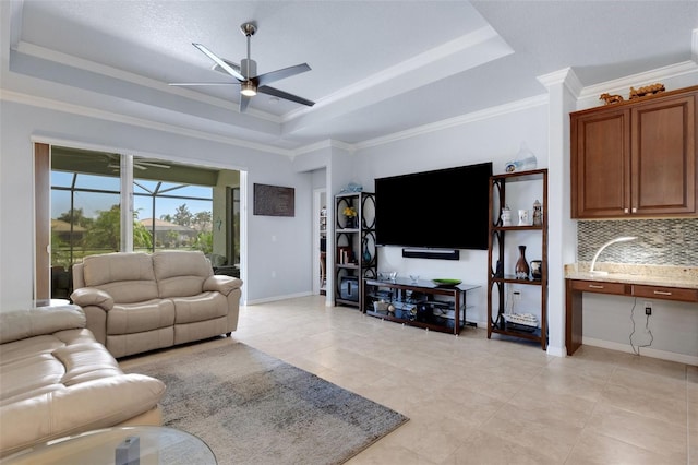 212 River Enclave Ct, Bradenton, FL 34212 - living area featuring a tray ceiling, ceiling fan, ornamental molding, light tile patterned floors, and baseboards