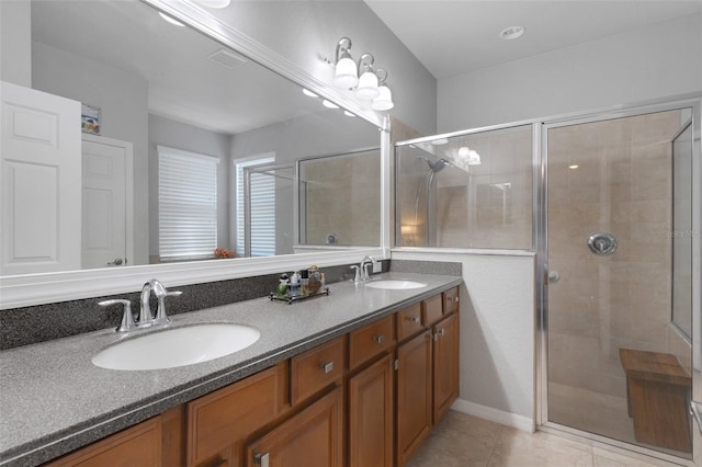 212 River Enclave Ct, Bradenton, FL 34212 - full bathroom with a shower stall, tile patterned flooring, and double vanity