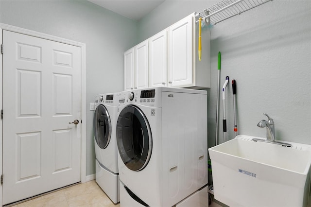 212 River Enclave Ct, Bradenton, FL 34212 - washroom with independent washer and dryer, cabinet space, and light tile patterned flooring