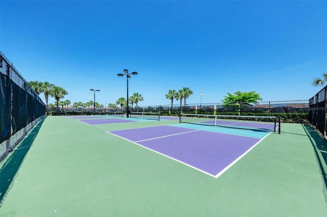 212 River Enclave Ct, Bradenton, FL 34212 - view of tennis court featuring fence
