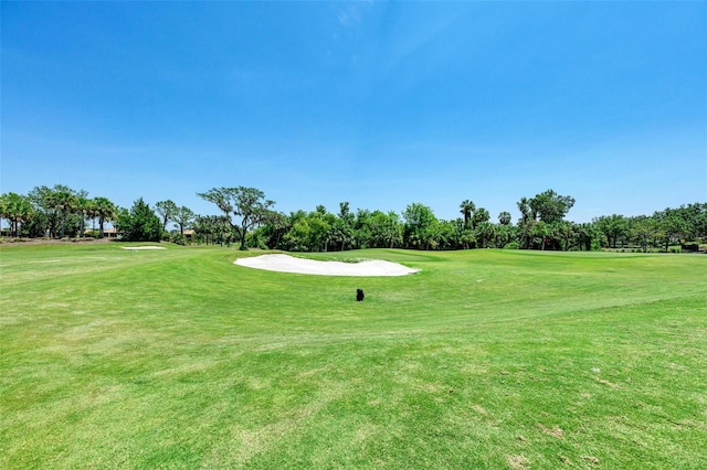 212 River Enclave Ct, Bradenton, FL 34212 - surrounding community featuring golf course view, view of wooded area, and a yard