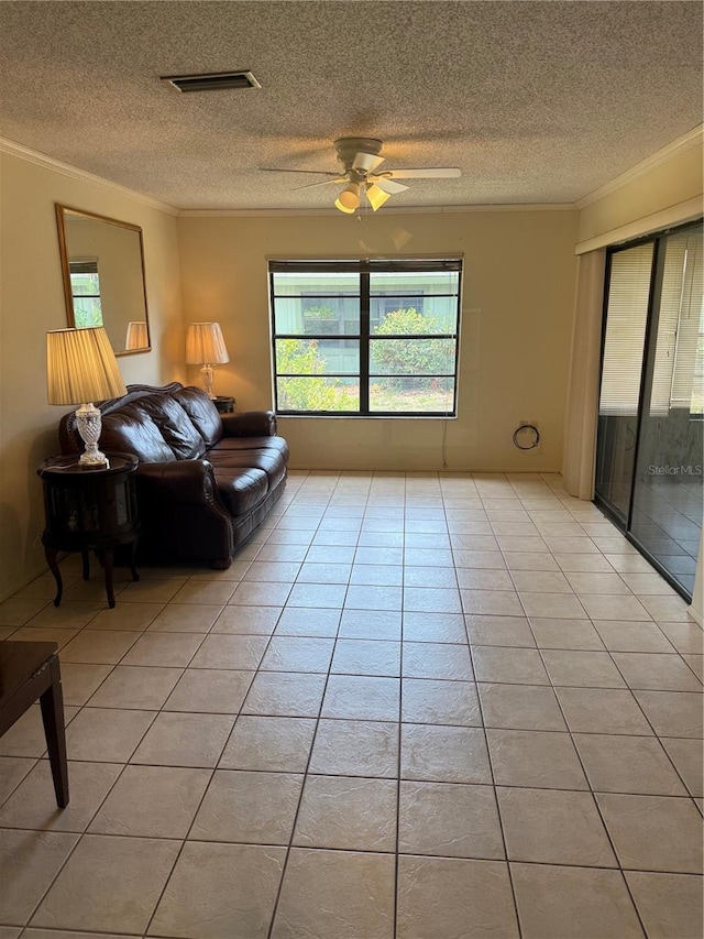 5014 Barrington Cir Unit 2102, Sarasota, FL 34234 - living area with ornamental molding, a textured ceiling, ceiling fan, and light tile patterned flooring
