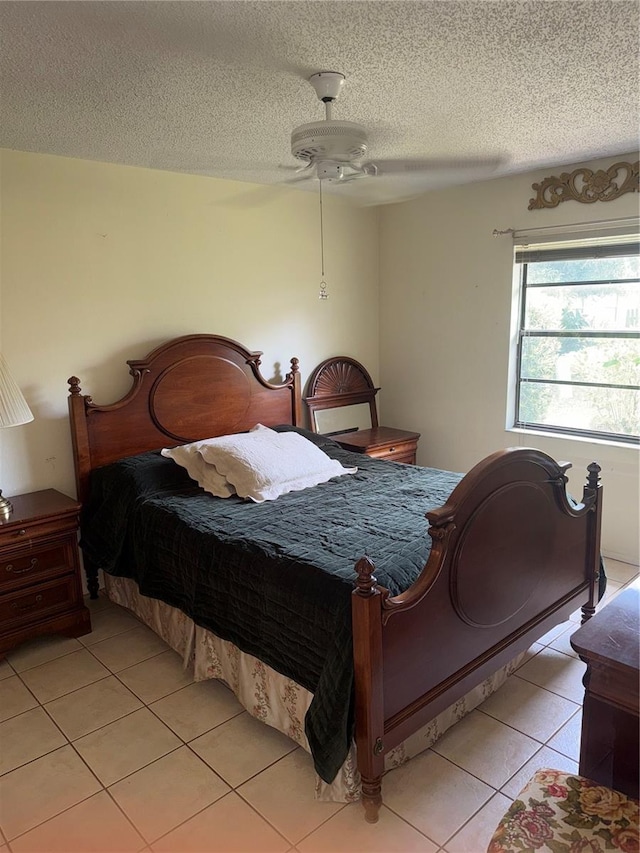 5014 Barrington Cir Unit 2102, Sarasota, FL 34234 - bedroom featuring light tile patterned floors, a textured ceiling, and a ceiling fan