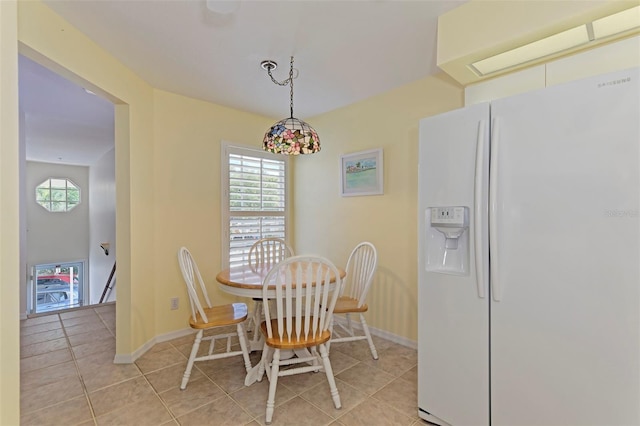 802 Montrose Dr Unit 204, Venice, FL 34293 - dining area featuring light tile patterned floors and baseboards
