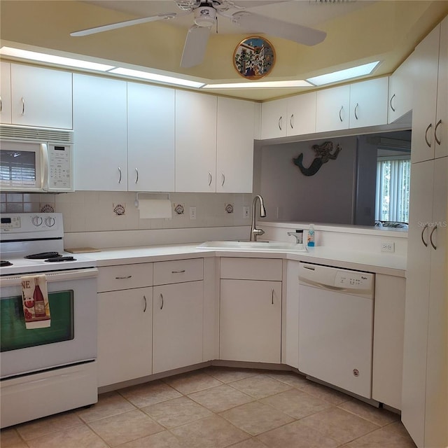 802 Montrose Dr Unit 204, Venice, FL 34293 - kitchen featuring white appliances, a sink, ceiling fan, and light countertops