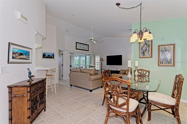 802 Montrose Dr Unit 204, Venice, FL 34293 - dining space with light tile patterned floors, a chandelier, high vaulted ceiling, and ceiling fan
