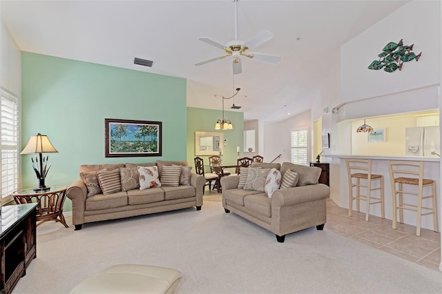 802 Montrose Dr Unit 204, Venice, FL 34293 - carpeted living area with ceiling fan and high vaulted ceiling