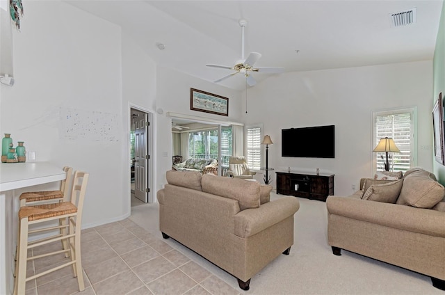 802 Montrose Dr Unit 204, Venice, FL 34293 - living room featuring ceiling fan, high vaulted ceiling, light tile patterned flooring, and baseboards