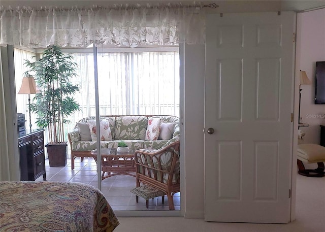 802 Montrose Dr Unit 204, Venice, FL 34293 - bedroom with light tile patterned floors and multiple windows