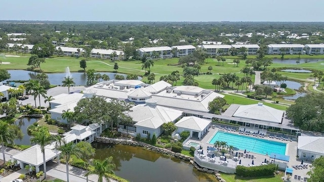 802 Montrose Dr Unit 204, Venice, FL 34293 - aerial perspective of suburban area featuring a golf course, a pool area, and a nearby body of water