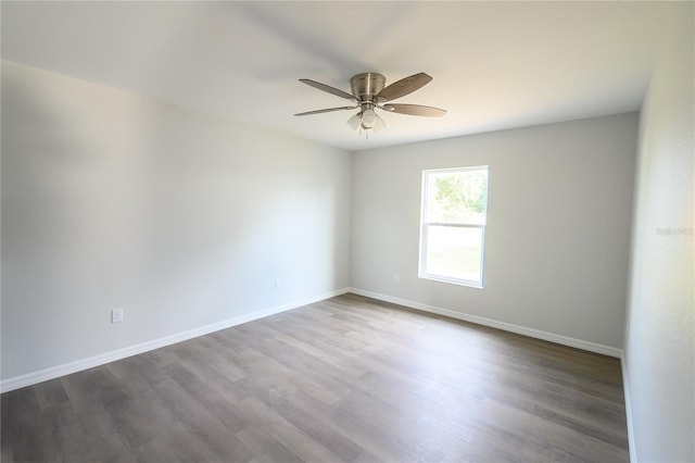 1208 SE Mills Ave, Arcadia, FL 34266 - spare room featuring ceiling fan, baseboards, and dark wood-style floors