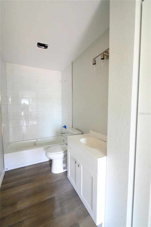 1208 SE Mills Ave, Arcadia, FL 34266 - bathroom with toilet, wood finished floors, and vanity