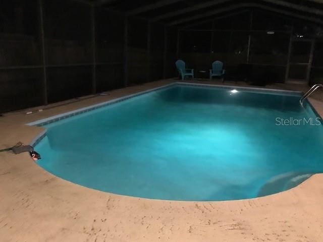2726 Knoll St E, Palm Harbor, FL 34683 - outdoor pool with glass enclosure and a patio